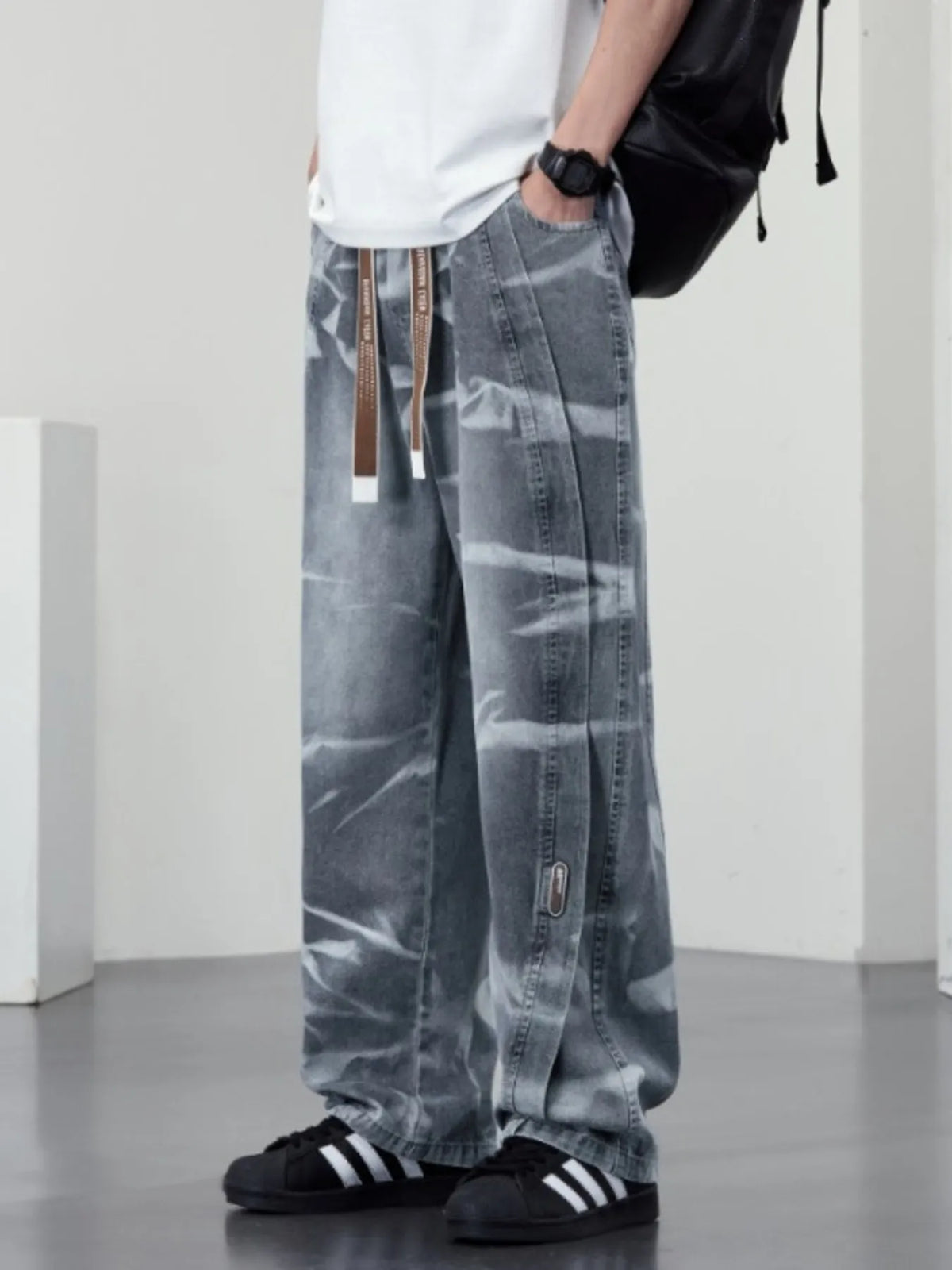 Plus size men's washed wide-leg jeans from Plush Fashion Hub, showing the relaxed fit and faded denim fabric.