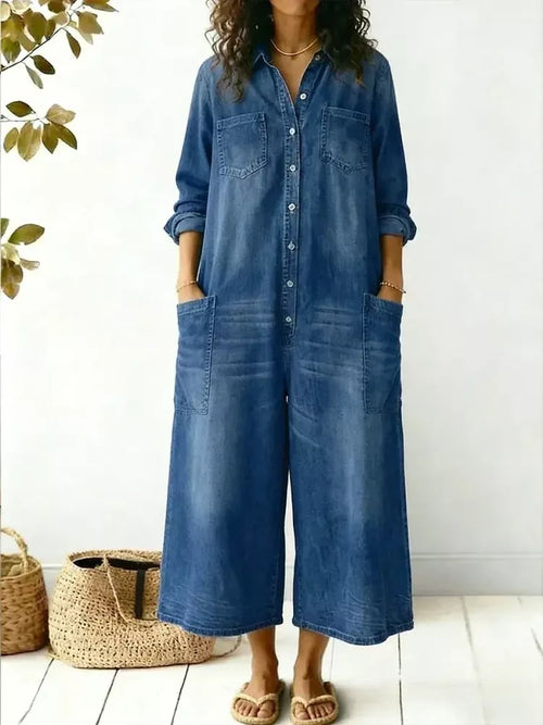 Plus size button front wide leg jumpsuit with chest pockets by Trendsi, featuring a full-length design and relaxed fit.
