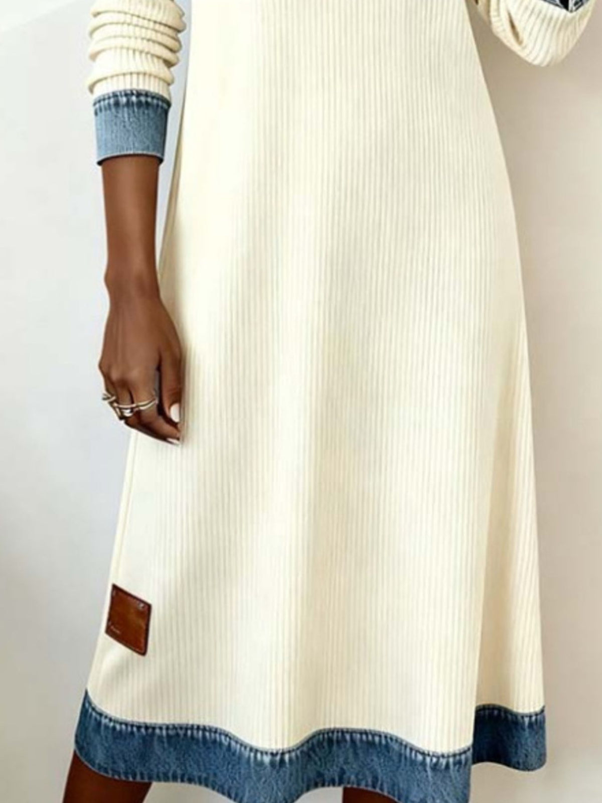 Plus size denim trim ribbed knit midi dress with a fitted silhouette, featuring a stylish neckline and long sleeves.