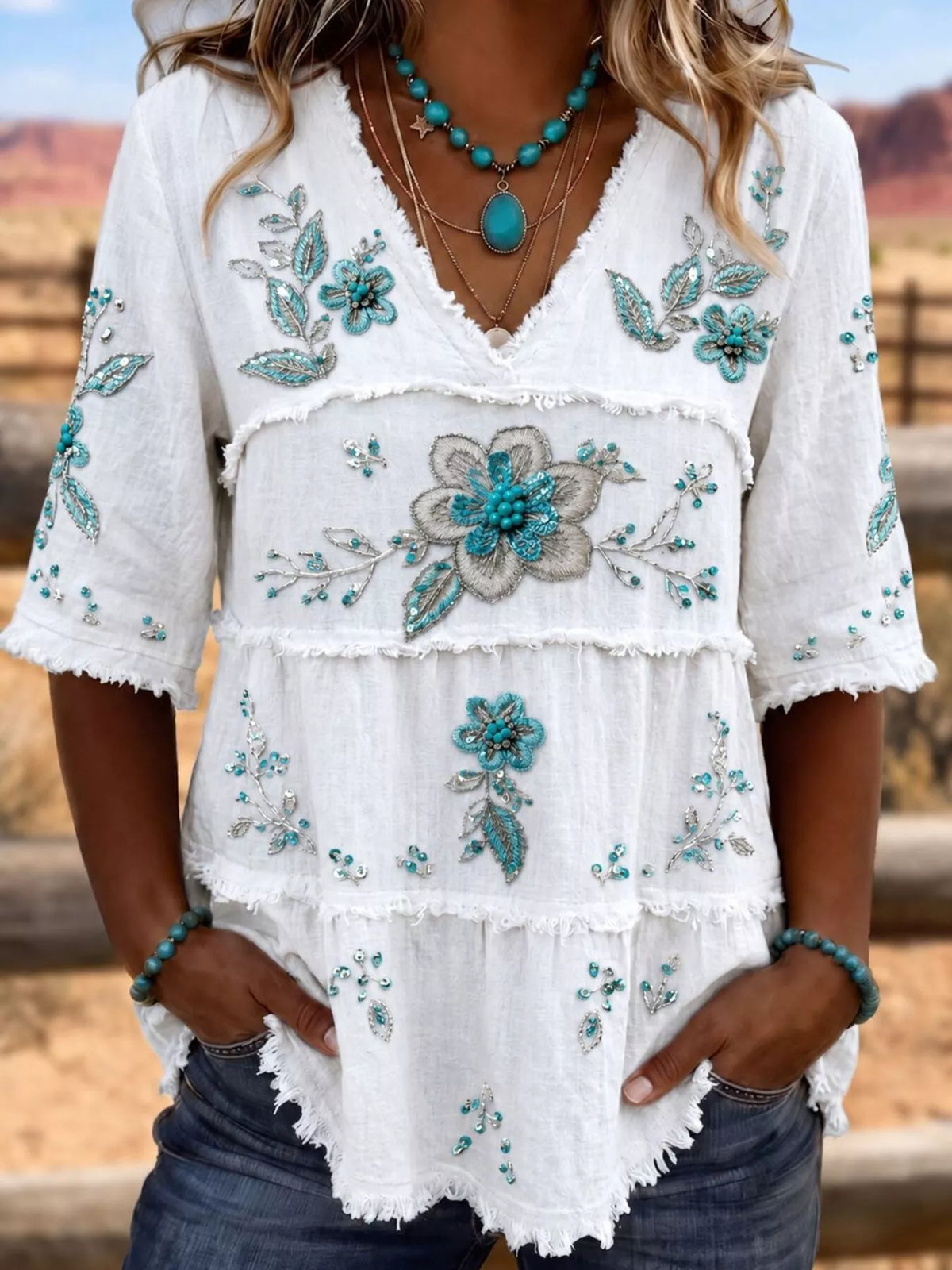 Plus size floral raw hem V-neck blouse by Trendsi, featuring full size shirt with flowy fabric and decorative floral pattern.