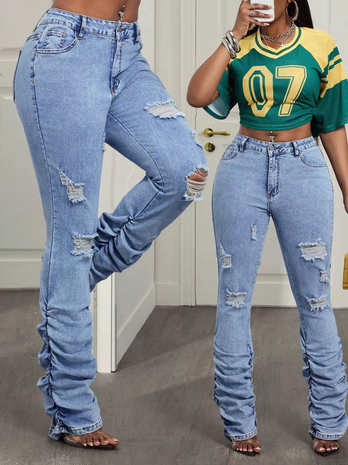 Pair of high-waisted distressed stacked hem jeans by Trendsi, showcasing a casual fit and frayed hem detail.