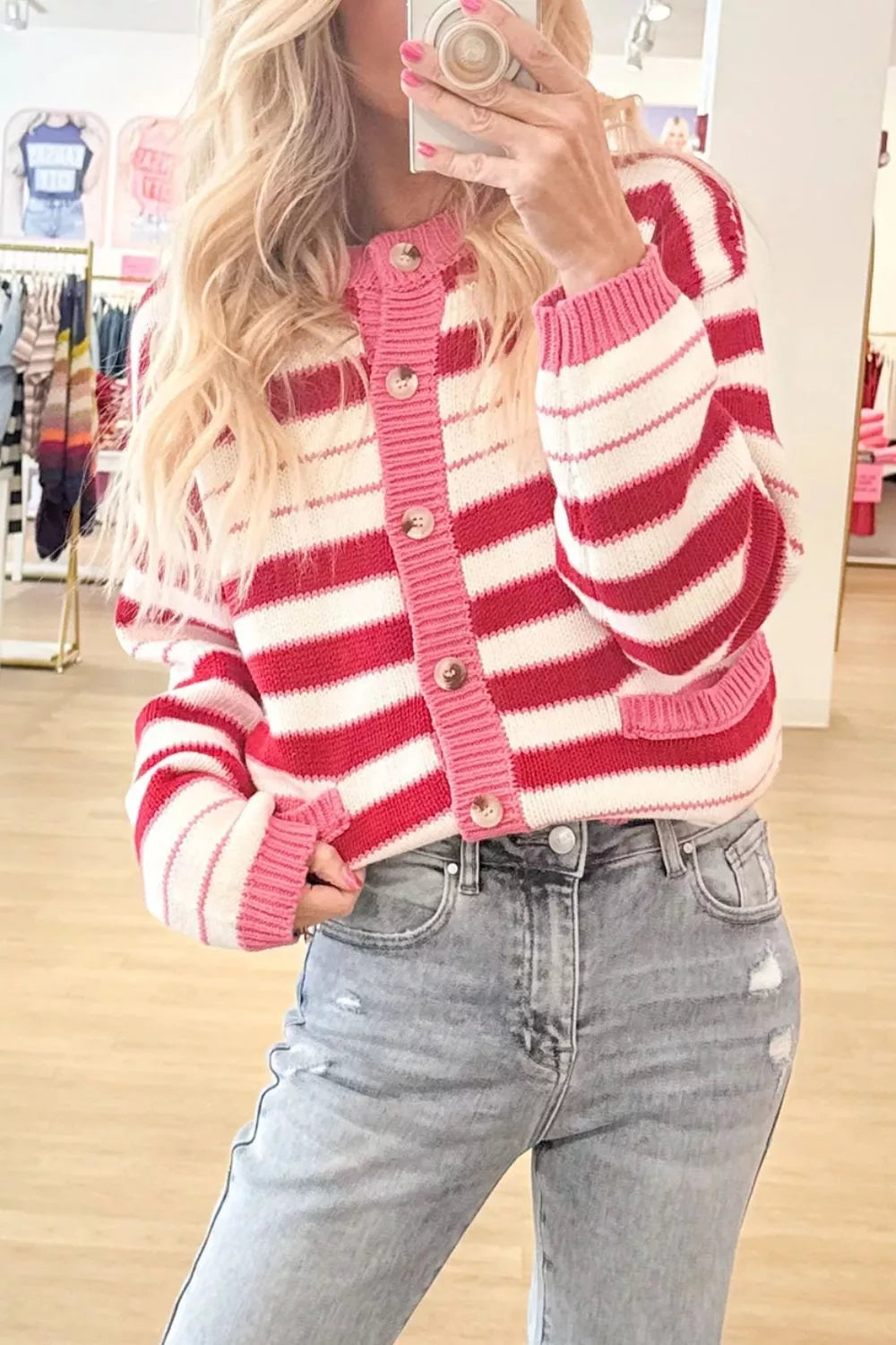 Striped V-neck long sleeve cardigan by Trendsi featuring a regular fit and button closure, with colorful horizontal stripes.