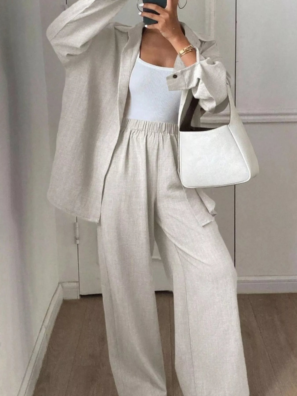 Trendsi long sleeve button-up shirt and wide-leg pants set, stylish and comfortable outfit for casual or office wear.