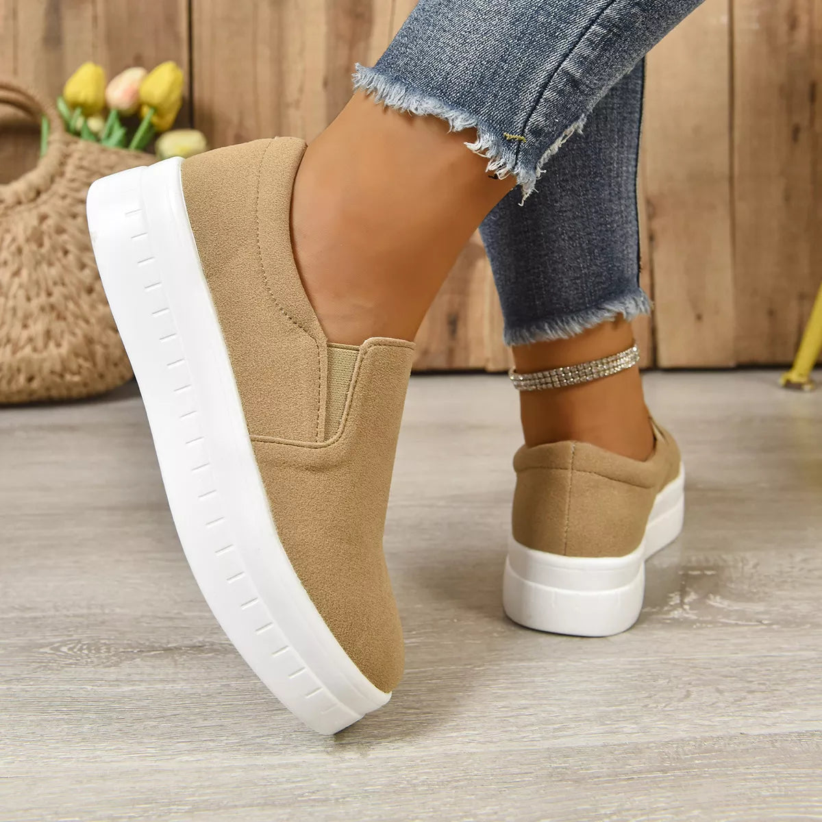 Round toe platform slip-on footwear from Trendsi, featuring a sleek design and comfortable sole for casual wear.