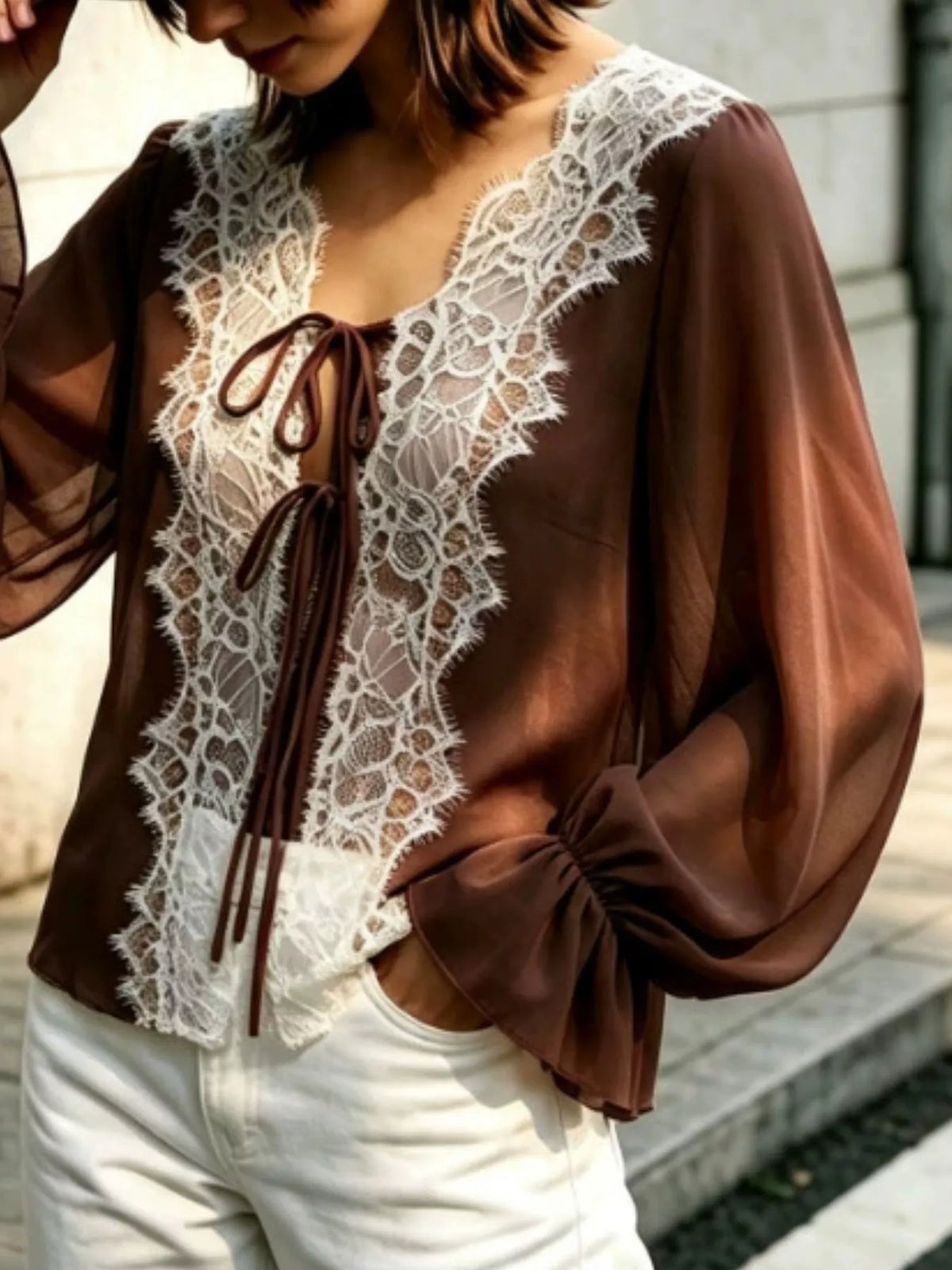 Sheer lace-trimmed front tie blouse for women, featuring delicate lace details and a lightweight, stylish design.