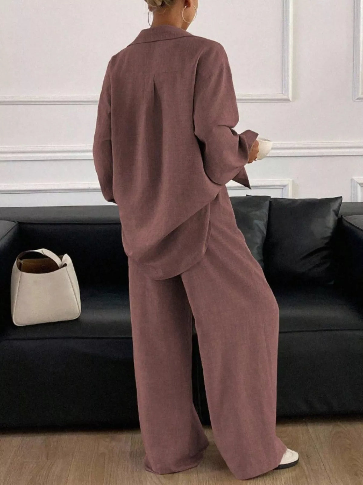 Trendsi long sleeve button-up shirt and wide-leg pants set, stylish and comfortable, shown on a model.