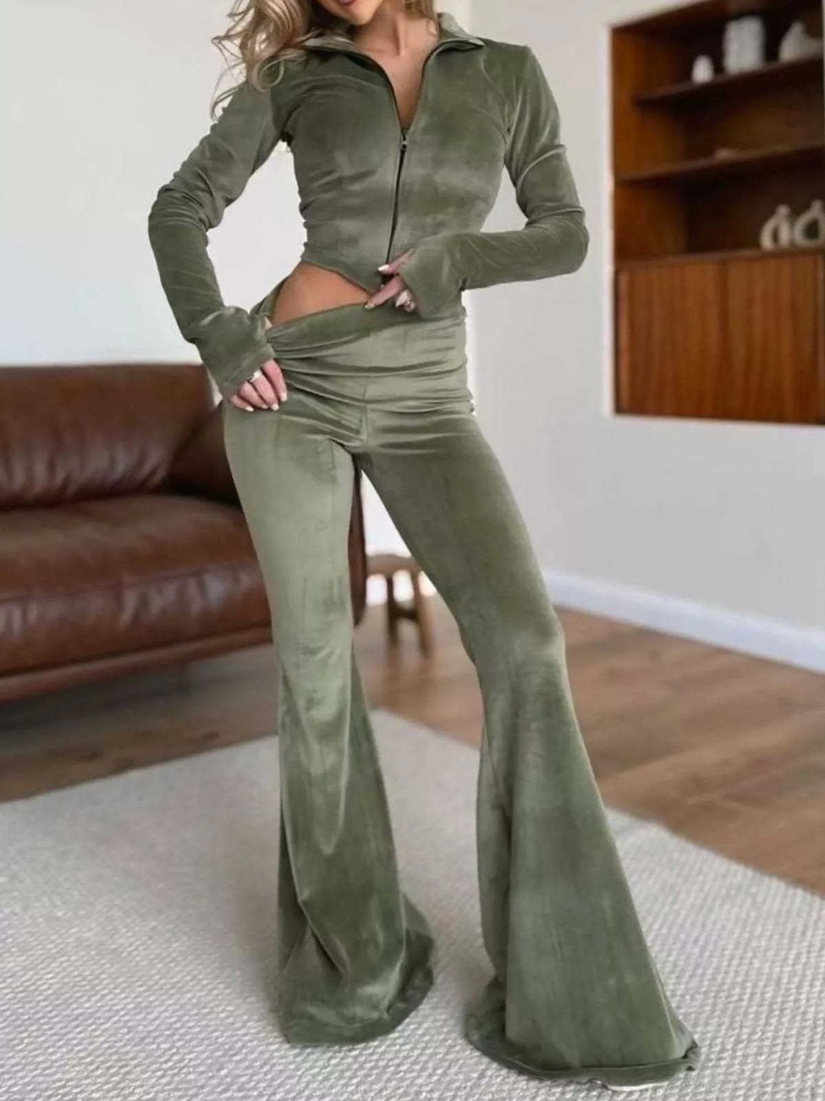 Trendsi zip-up crop top and flared pants two-piece set, stylish matching ensemble, black fabric, front zipper details, casual fashion look