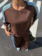 Trendsi striped short sleeve top and matching pants set for women, featuring a stylish, casual two-piece outfit.