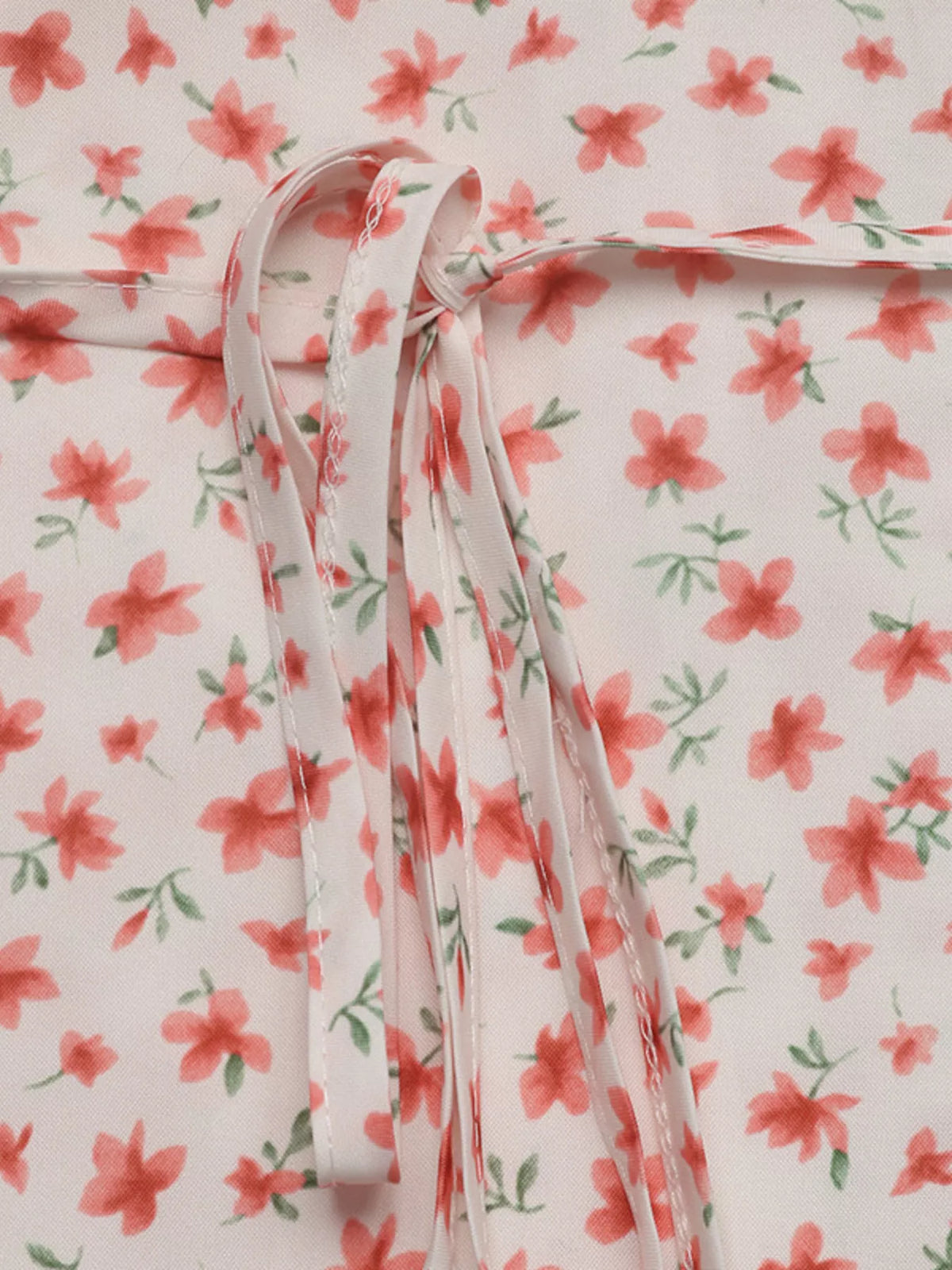 Floral print V-neck puff sleeve mini summer dress for women by Plush Fashion Hub, featuring a bright floral pattern and flowy design.