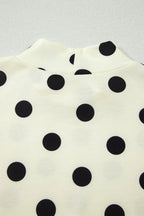 Polka dot print high neck dolman top in black and white, trendy women's tops with relaxed fit and long sleeves.