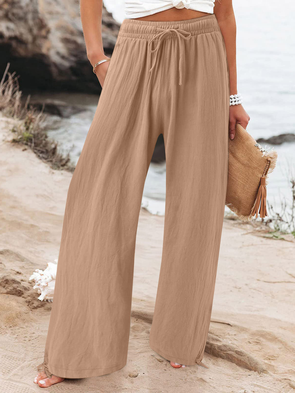 Plus size full-length drawstring wide-leg pants by Trendsi, featuring a relaxed fit and comfortable waistband.