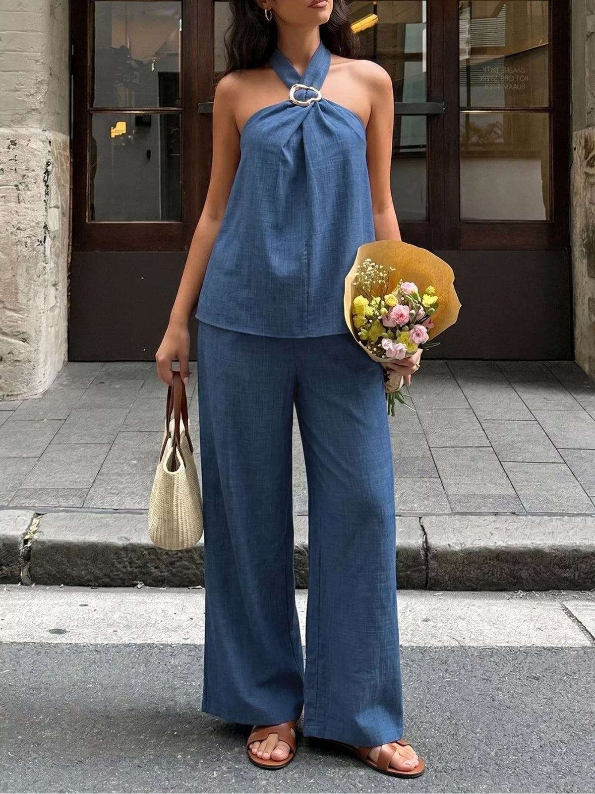 Plush Fashion Hub two-piece halter neck top and wide-leg pants set, featuring stylish, coordinated fashion for women.