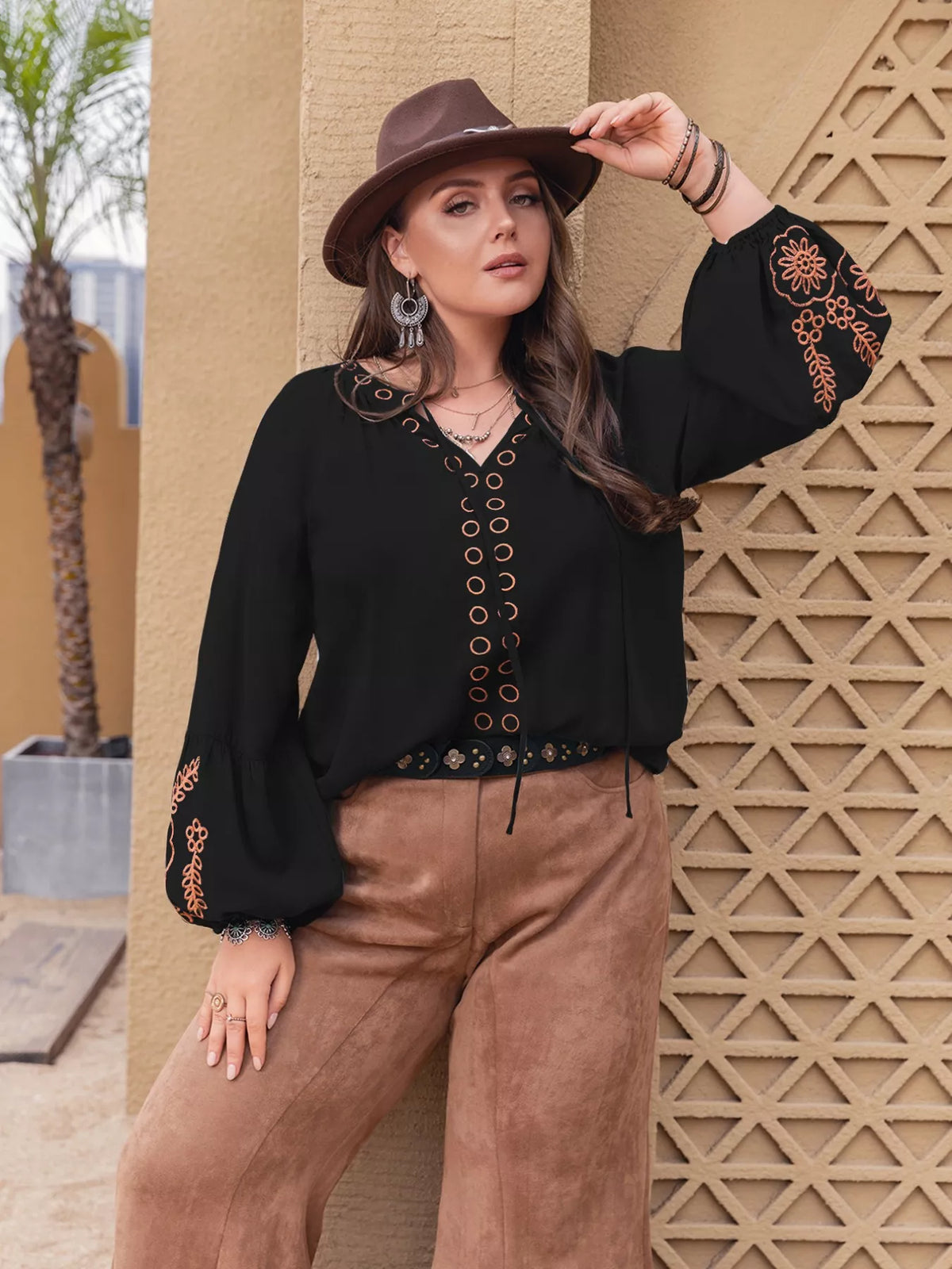 Plus size boho embroidered long sleeve blouse by Simply Love with colorful embroidery and relaxed fit, displayed on a hanger.