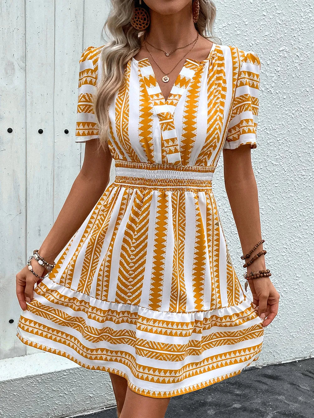 Geometric notched short sleeve mini dress by Plush Fashion Hub, stylish mini dress with unique geometric patterns and modern design.