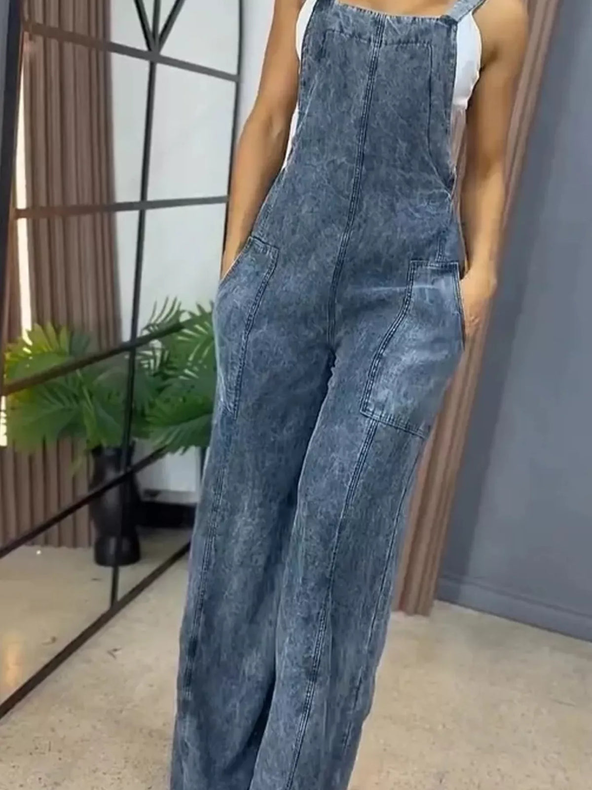Blue wide-leg denim overalls by Plush Fashion Hub, full size one-piece with adjustable straps and front pockets.