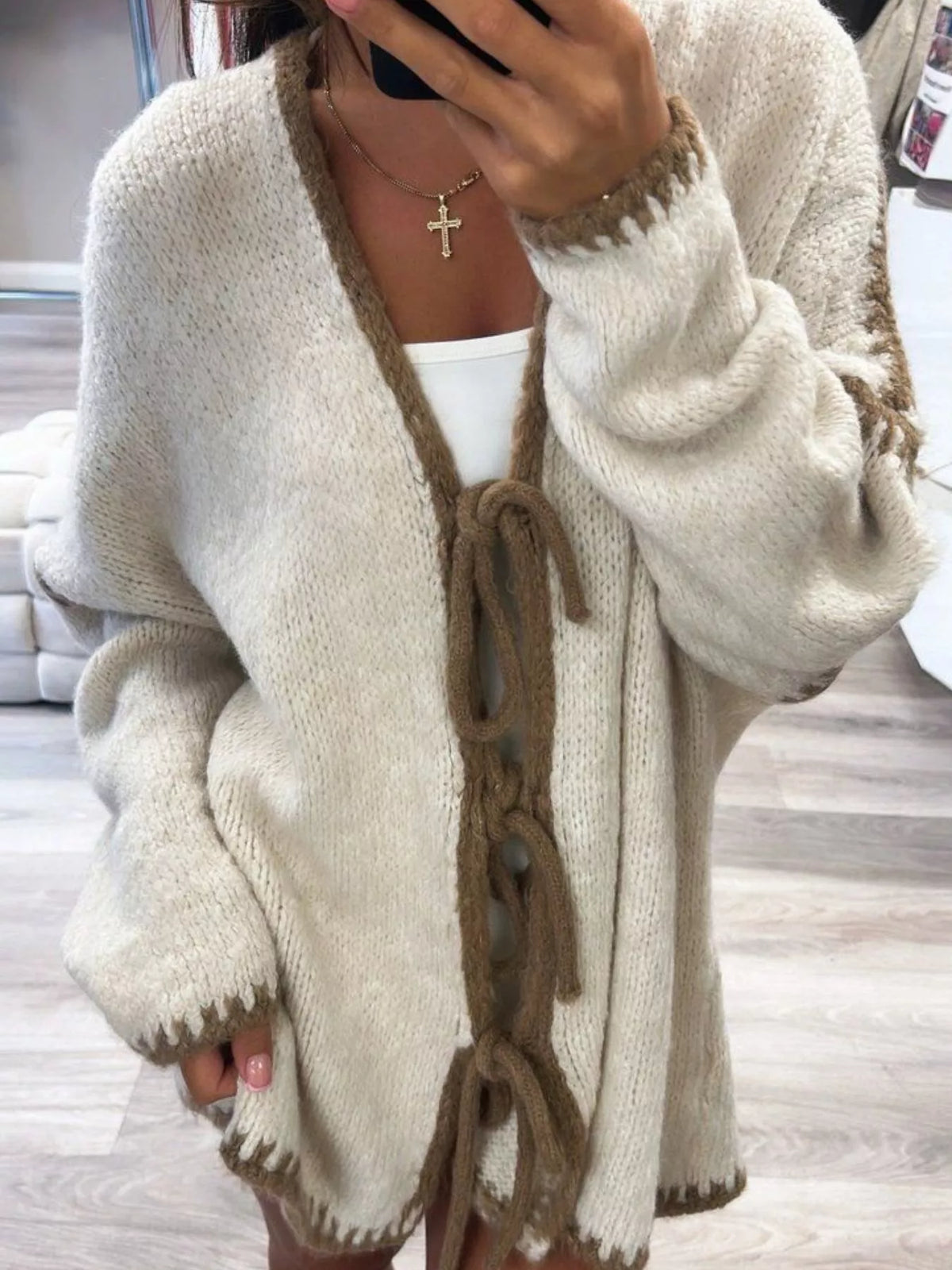 Tie front drop shoulder cardigan by Trendsi featuring a relaxed fit and soft knit fabric, perfect for casual styling.