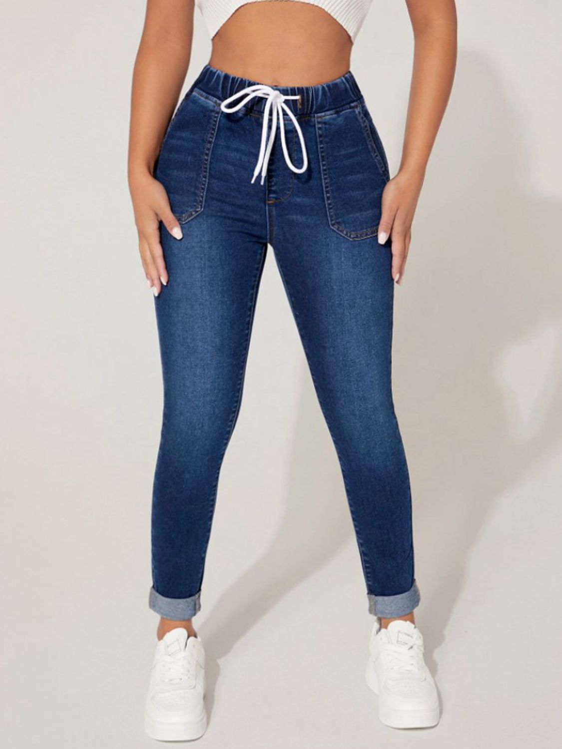 Plush Fashion Hub cropped denim jeans with drawstring waist, stylish and comfortable for casual wear, shown in a close-up image.