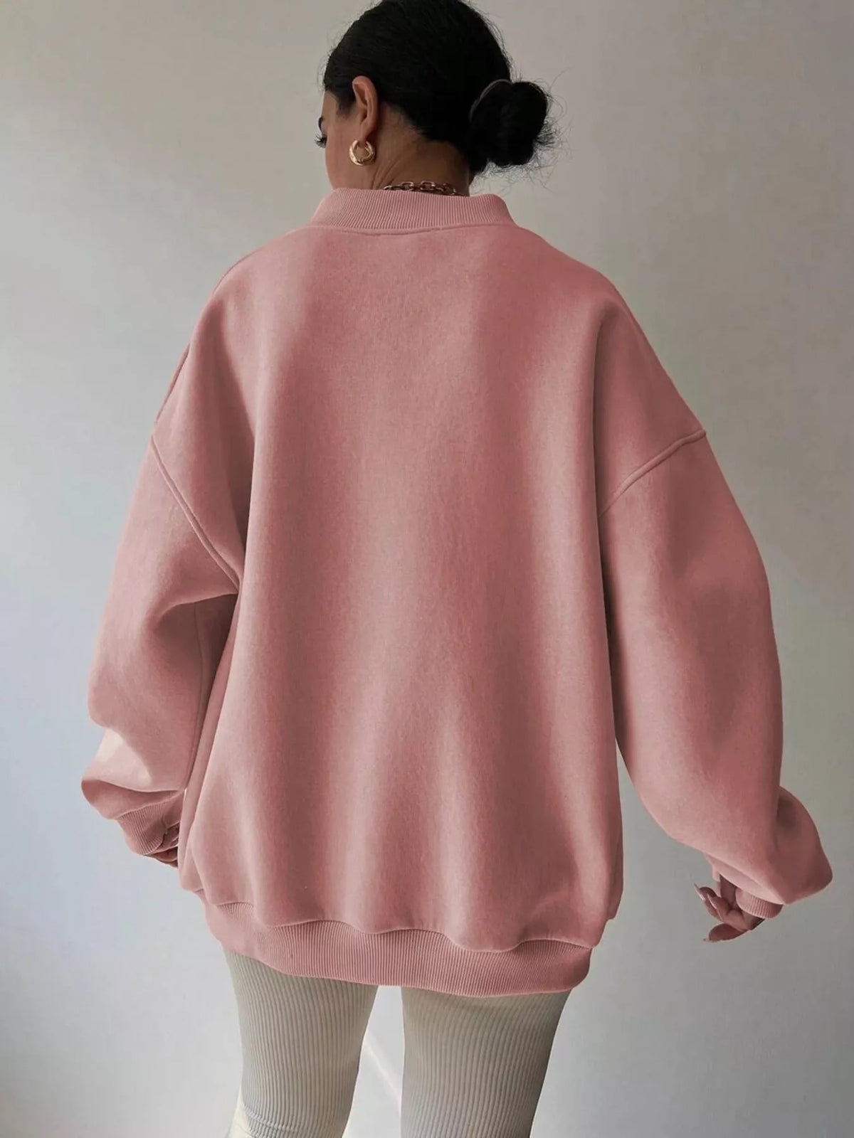 Gray dropped shoulder long sleeve oversized sweatshirt by Trendsi, featuring a relaxed fit and soft fabric, suitable for casual wear.