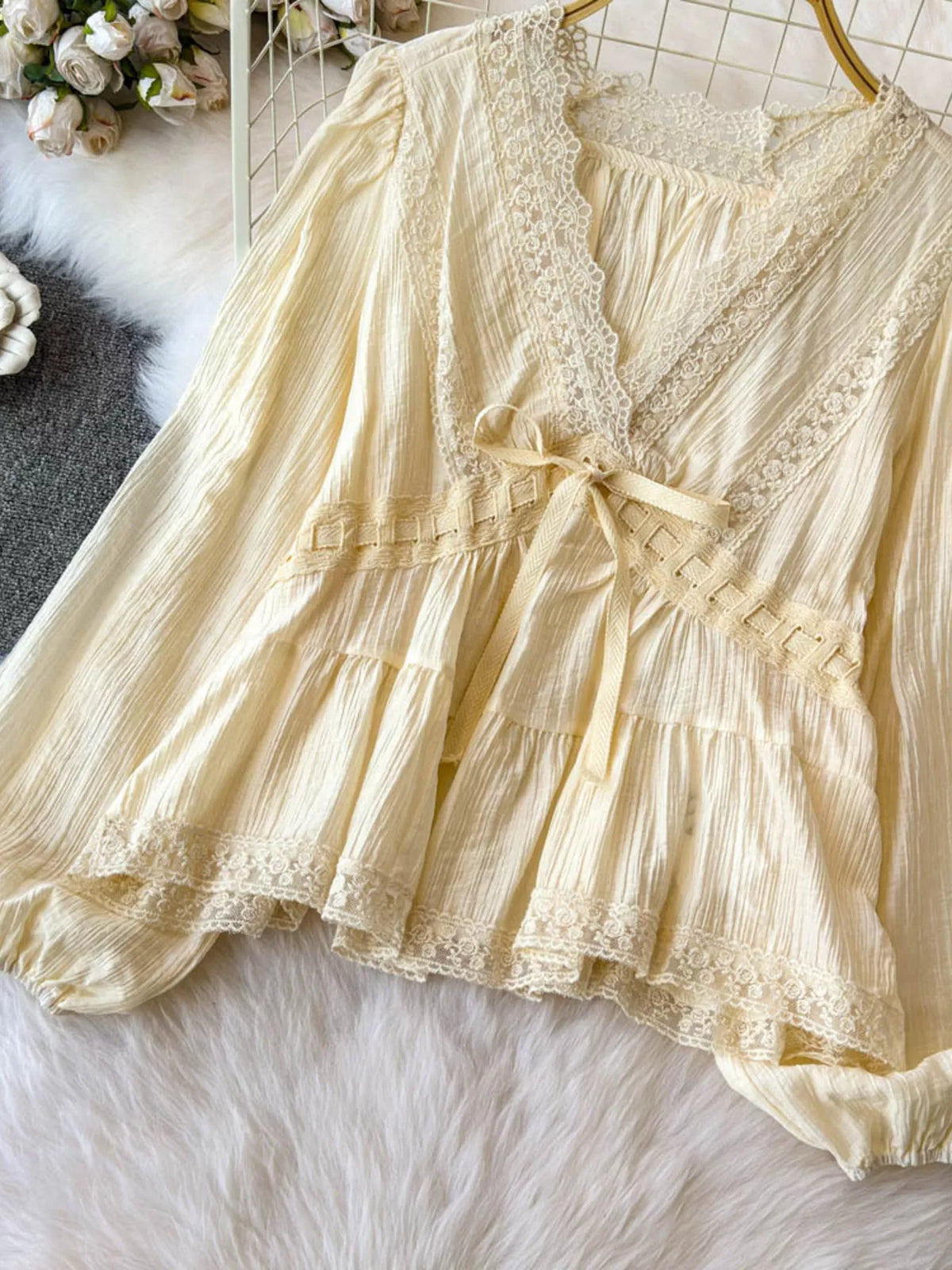 Lace detail V-neck blouse from Plush Fashion Hub, shown as a stylish dress with elegant lace accents and a flattering V-neck design.