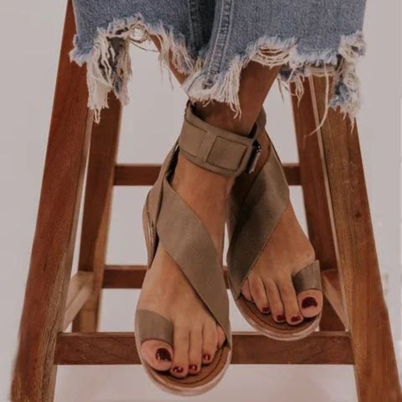 Plus size Roman style women's buckle toe slippers by LadyShow.Store featuring flat sandals with buckle detail and open toe design.