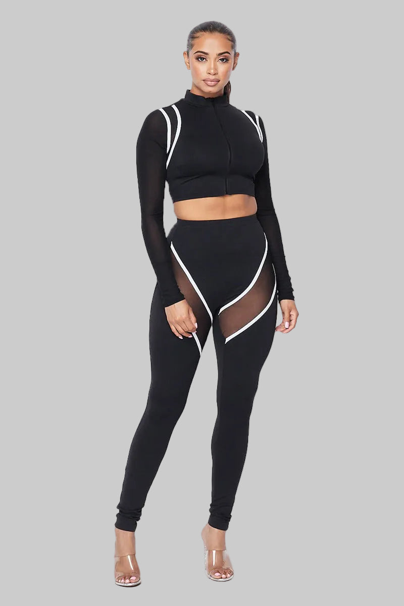 Two-piece spandex cropped jacket and legging set by The House of Stylez with see-through sleeves, fashionable activewear ensemble.