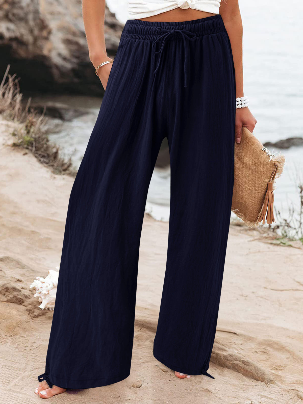 Plus size full length drawstring wide leg pants from Trendsi, featuring a comfortable fit and flowy silhouette.