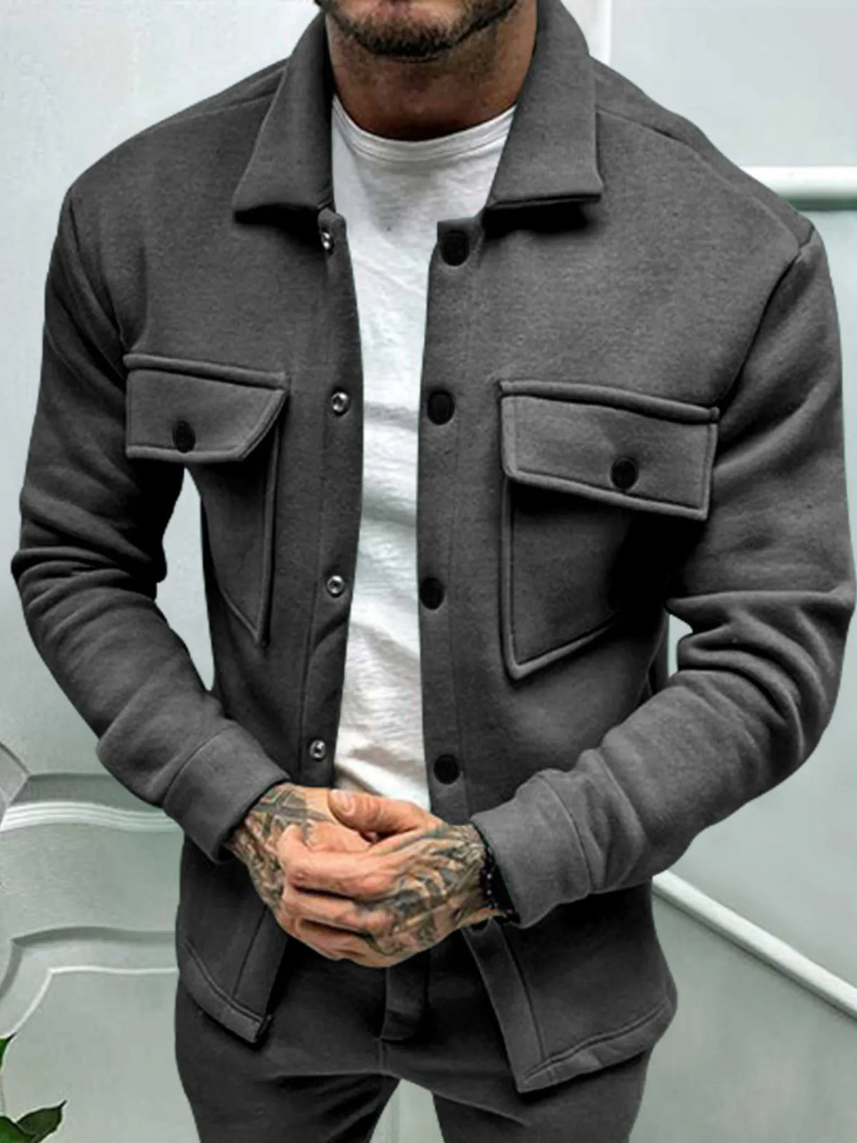 Men's full-size long sleeve button-up jacket by Trendsi, shown in a versatile style with a classic collar and front button closure.