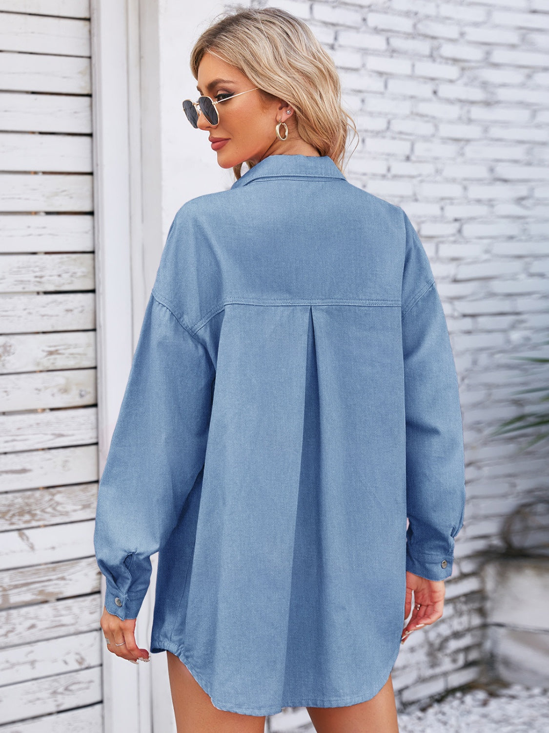 Pink denim shacket with pocketed snap buttons and dropped shoulders, featuring a casual, relaxed fit from Plush Fashion Hub.