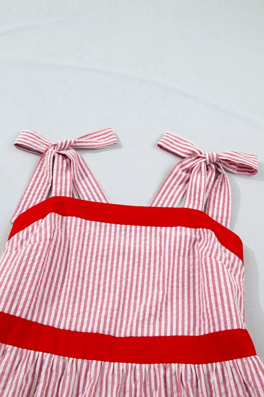Plush Fashion Hub stripe bow knot straps high waist maxi dress with contrast trim and ruffle hem, perfect for summer wear.