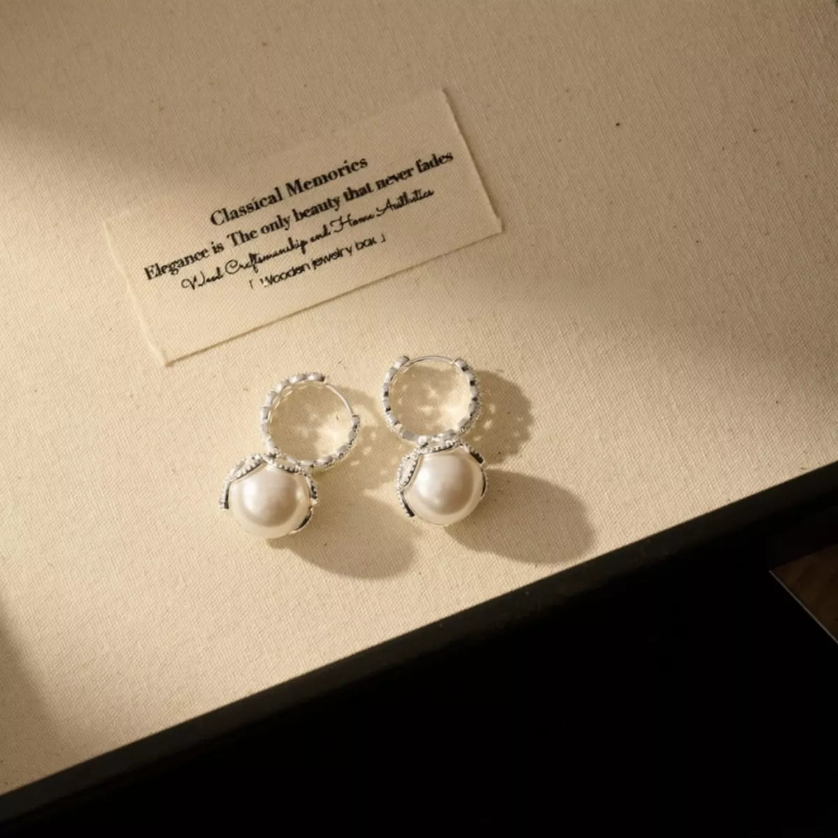 Plush Fashion Hub pearl hoop earrings with zircon accents, featuring elegant round pearls and sparkling zircon embellishments.