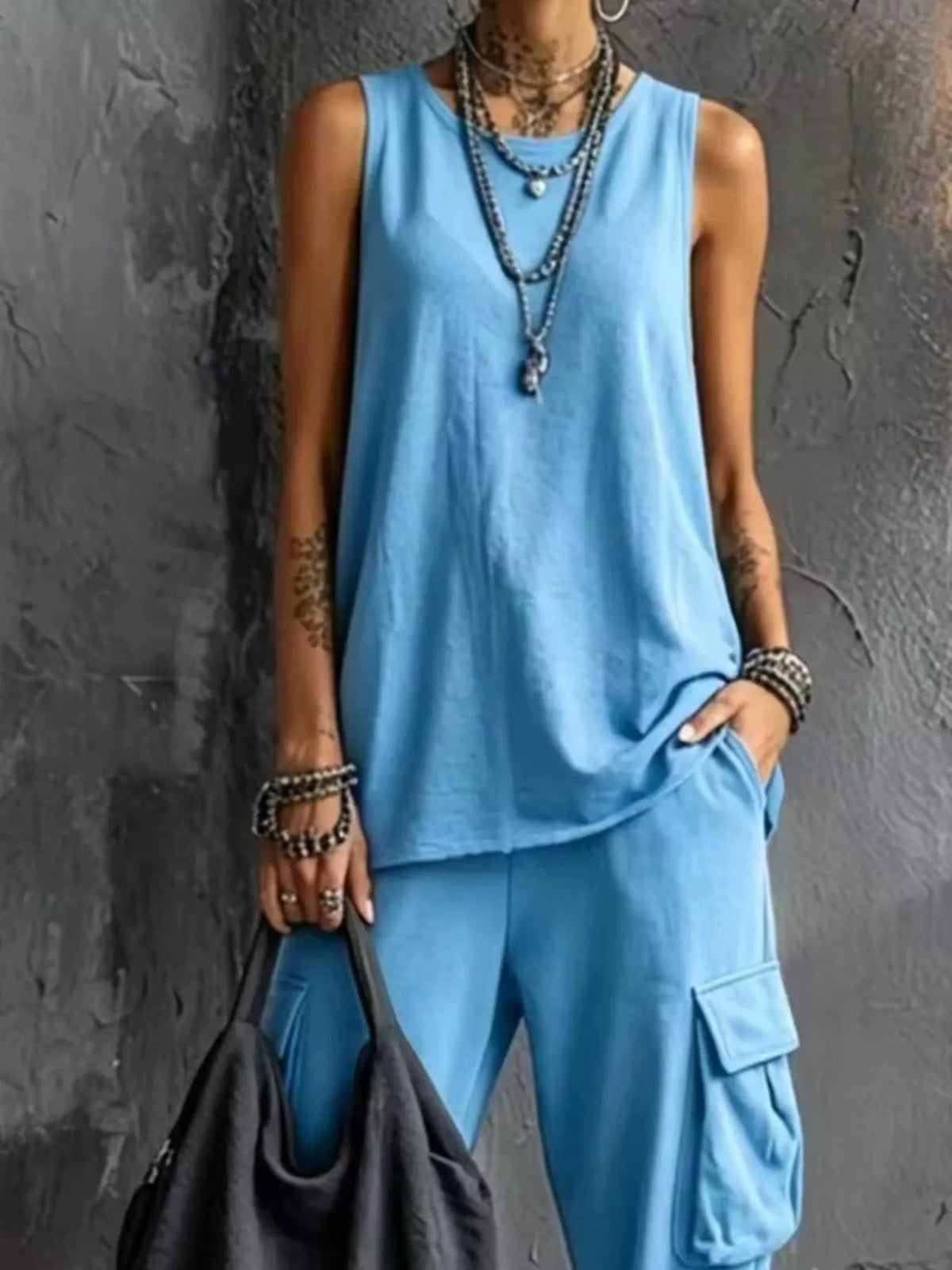 Plus size casual tank top and cargo pants set by Trendsi, featuring a comfortable sleeveless top and relaxed-fit cargo pants.