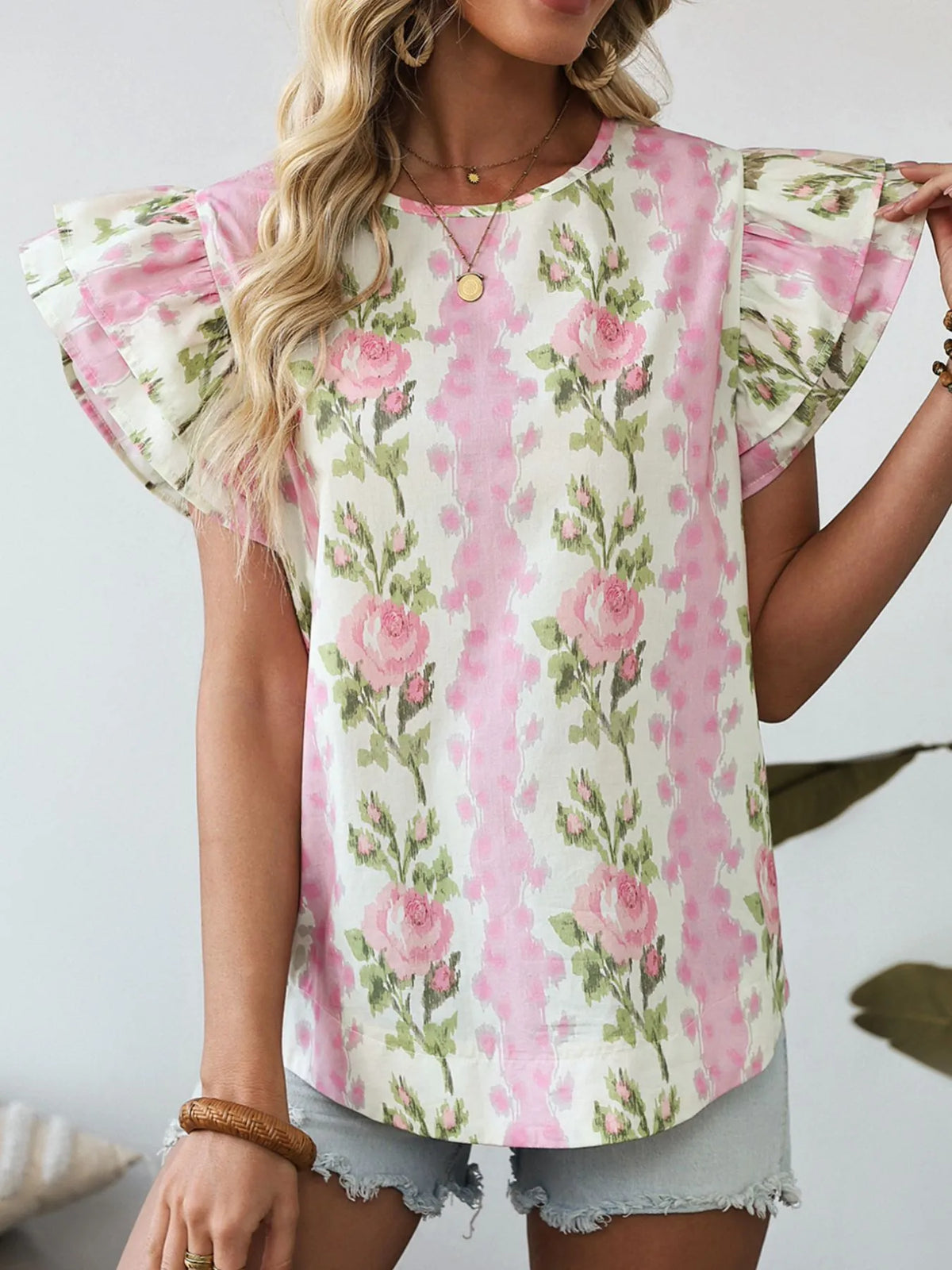 Floral print ruffled sleeve blouse by Plush Fashion Hub featuring vibrant floral patterns and feminine ruffle details.