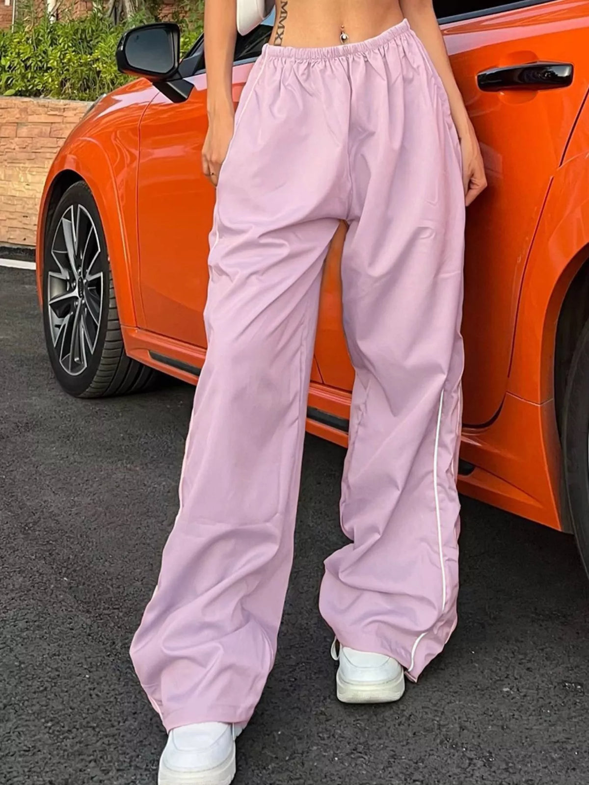 Women's lightweight high-rise wide-leg pants with elastic waist from Plush Fashion Hub, styled as a casual dress with flowy fabric.