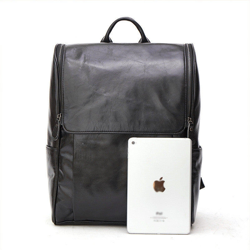Black leather computer backpack from Pi-Mart with multiple compartments and padded shoulder straps, designed for everyday use.