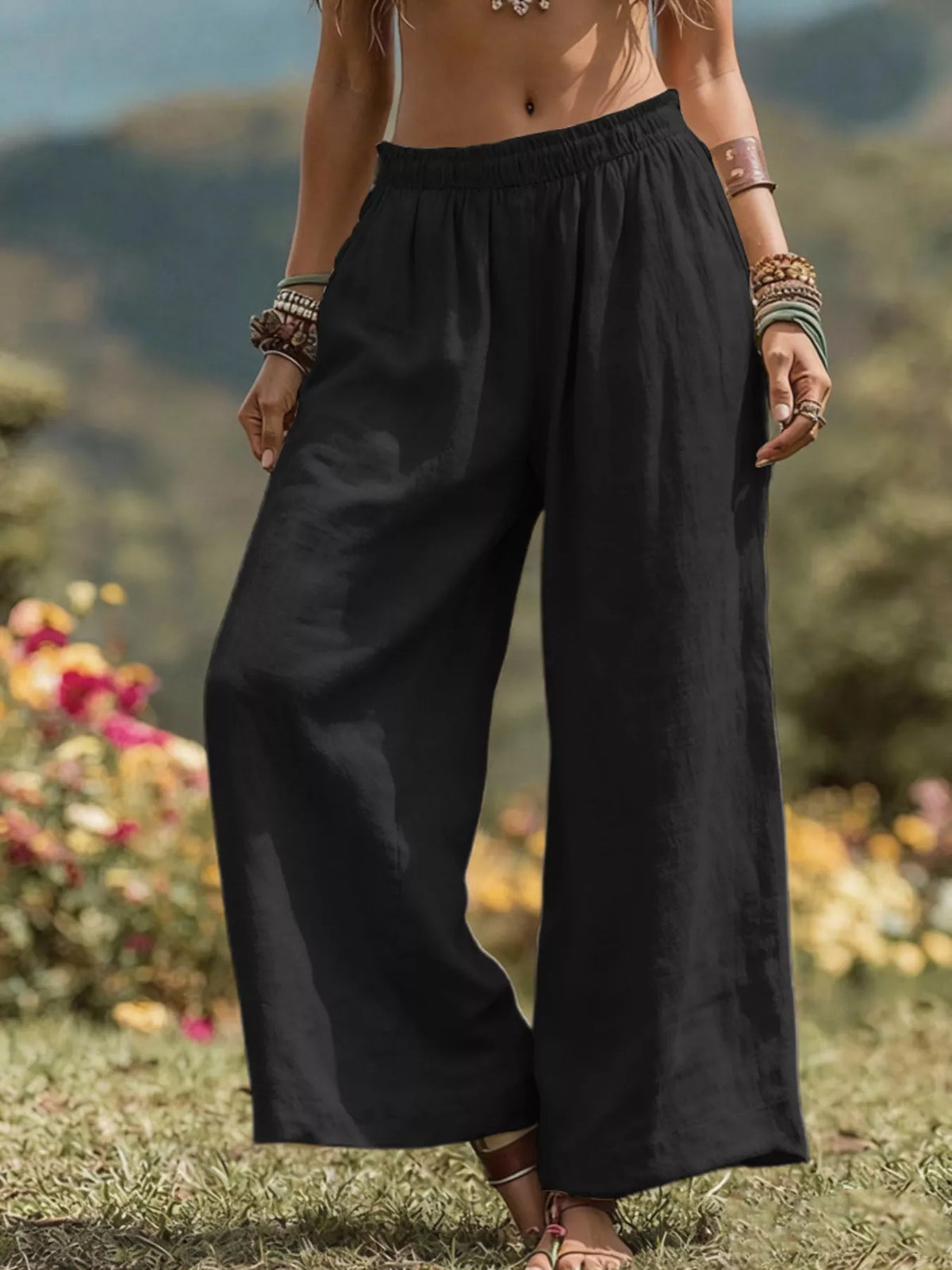 Plus size bohemian wide-leg pants by Trendsi, flowing full-length pants with a relaxed fit and boho style, shown on a model.