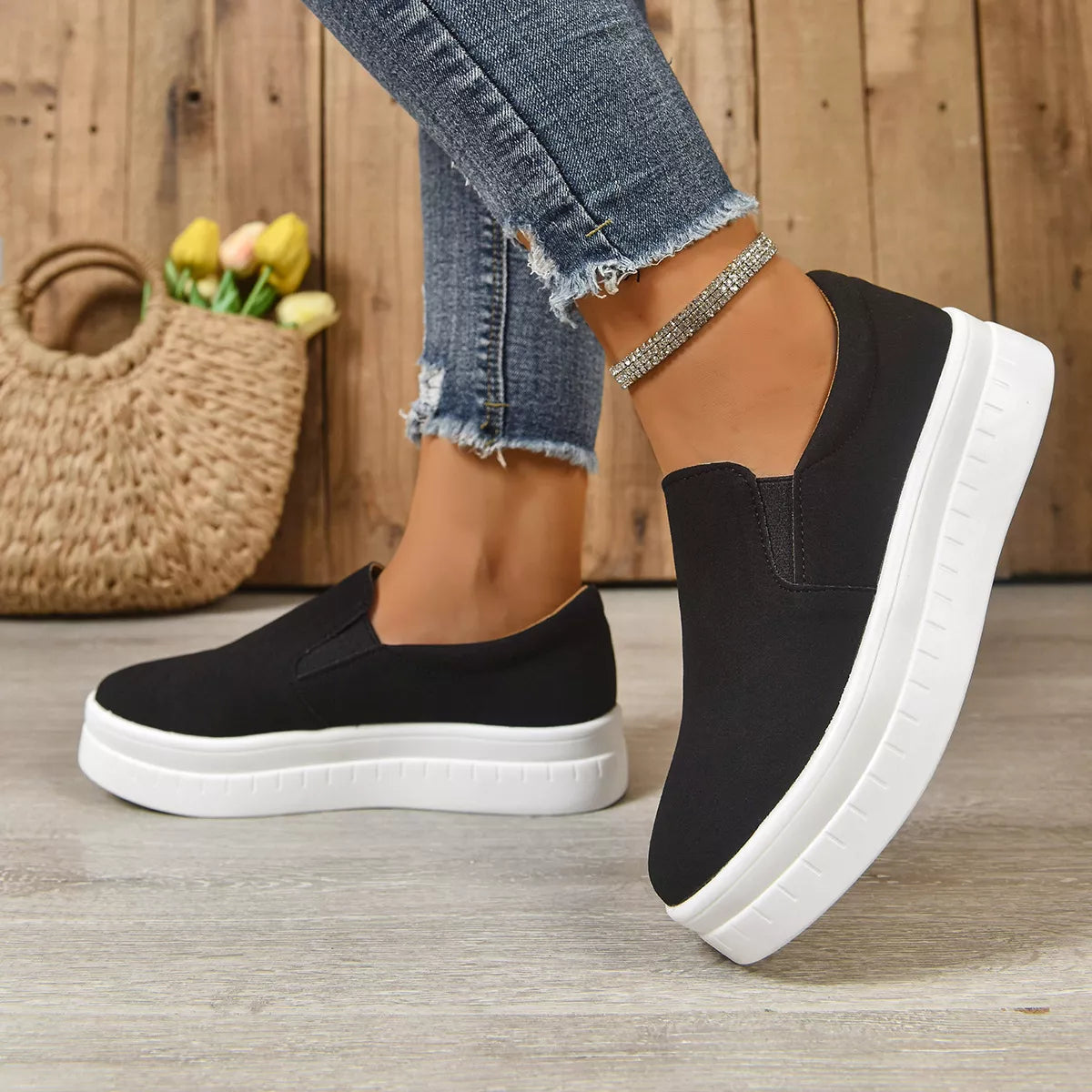 Round toe platform slip-on footwear by Trendsi featuring a sleek design and comfortable sole.