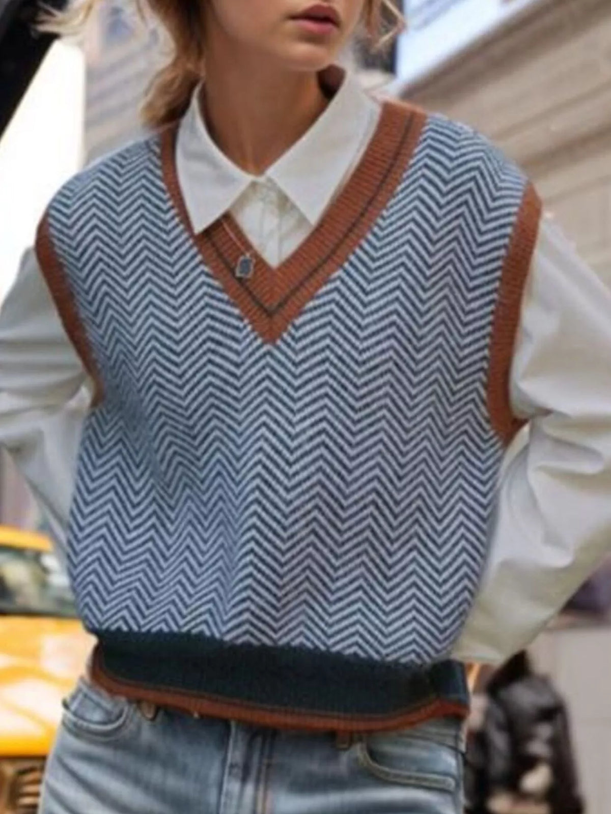 Chevron pattern V-neck knit sweater vest from Trendsi, featuring a stylish design and comfortable fit, seen in a close-up view.