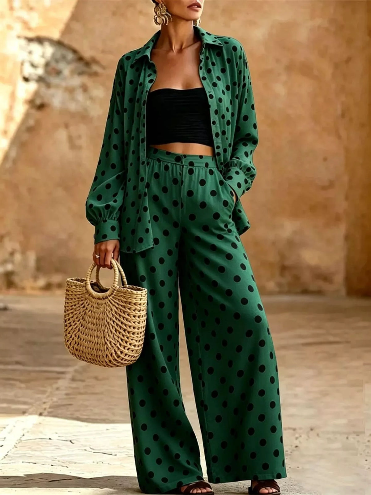Plus size polka dot shirt and wide-leg pants set by Trendsi, featuring a stylish polka dot top with flowy wide-leg pants.