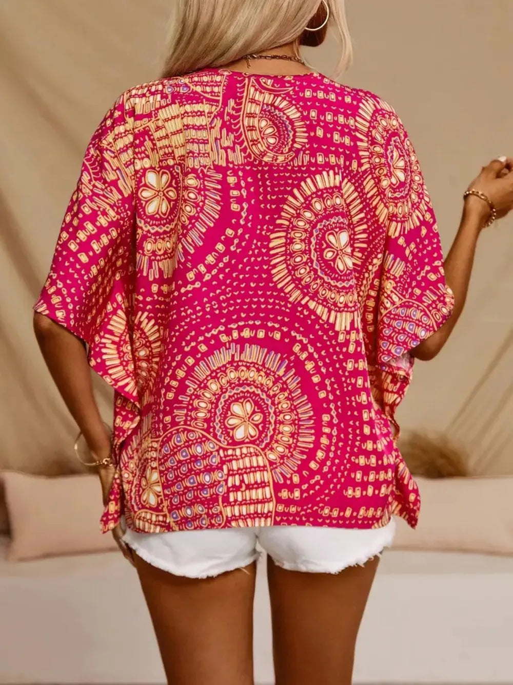 Women's printed V-neck half sleeve casual blouse from Plush Fashion Hub, soft stretch fabric, stylish office top with floral pattern.