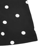 Flowy black and white polka dot strapless jumpsuit with wide legs, stylish and comfortable fashion by Trendsi.