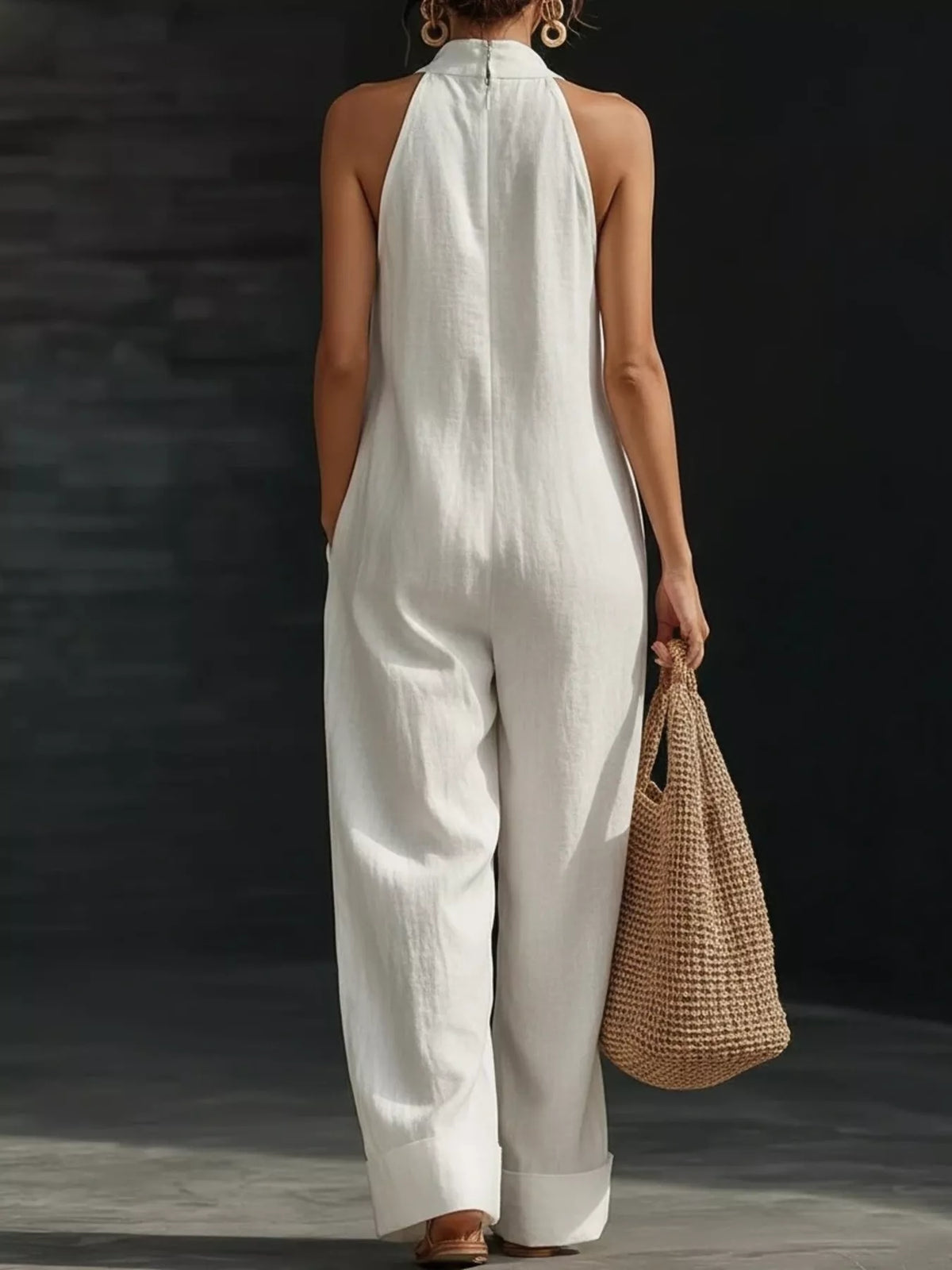 Plush Fashion Hub halter neck wide-leg jumpsuit in lightweight fabric, featuring a stylish design and flowing silhouette.