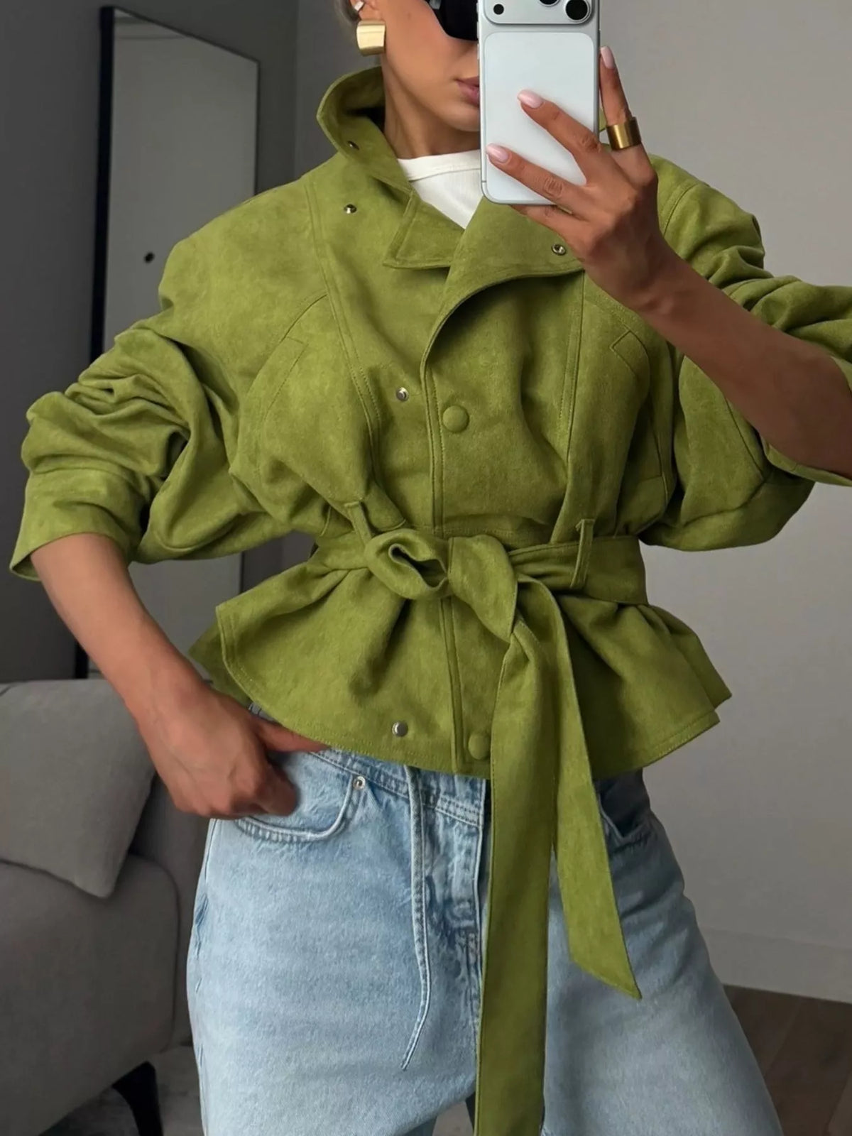 Women's tie waist long sleeve cropped jacket by Trendsi, featuring a fitted design and stylish collar, shown in a neutral color.