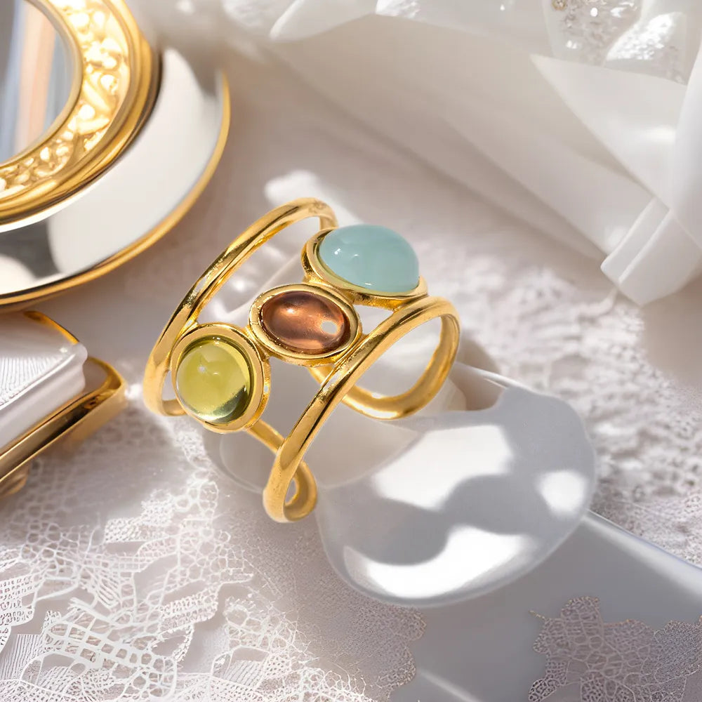 18K gold plated gemstone open cuff ring with intricate design, showcasing vibrant gemstones and a sleek open band style.