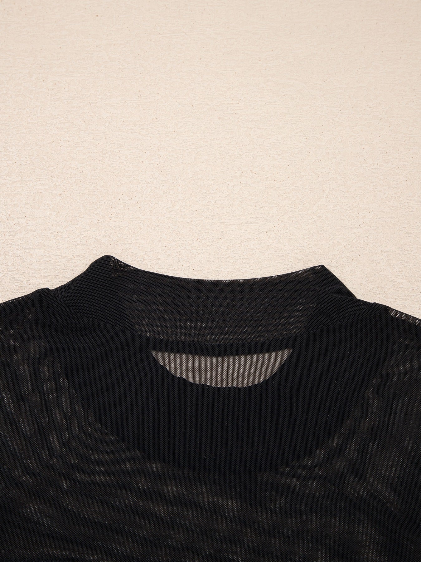 Women's sheer mesh patchwork cap sleeve t-shirt by Trendsi, showcasing elegant layering top with intricate mesh and patchwork design.