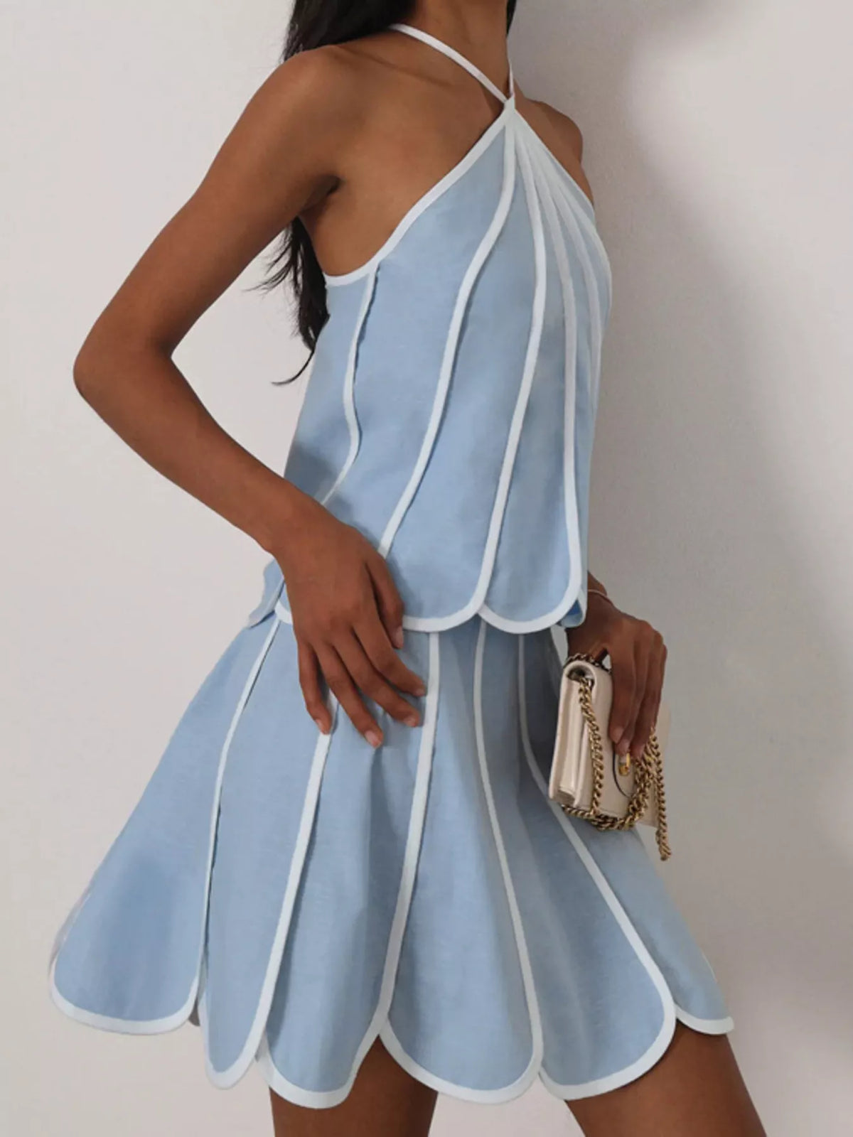 Contrast trim halter neck top and skirt set by Plush Fashion Hub, stylish matching outfit with sleeveless design and trendy accents.