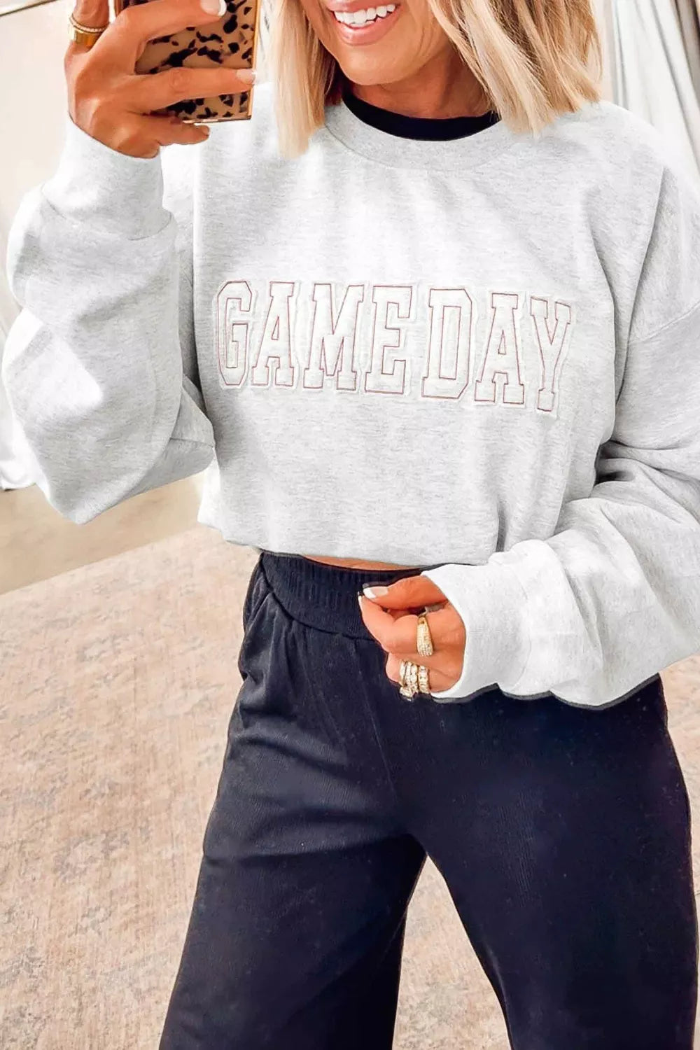 Women's embroidered long sleeve sweatshirt with letter design and round neck, stylish casual wear by Trendsi.