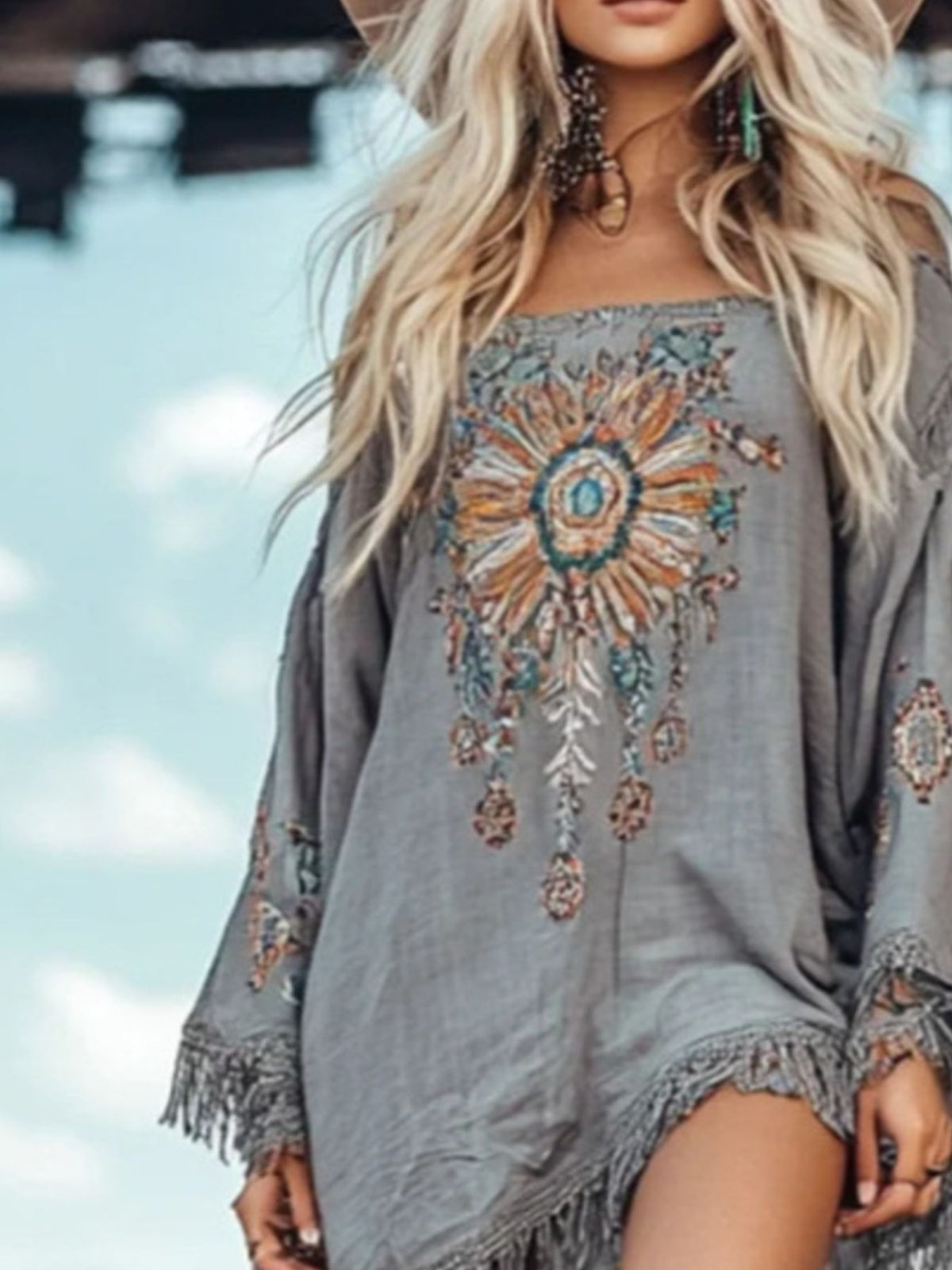 Elegant plush fashion hub fringe hem long sleeve mini dress, perfect for cocktail parties with chic style and sophisticated design.