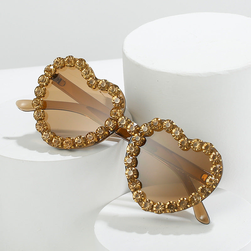 Peach heart-shaped rhinestone sunglasses in Y2K style, featuring sparkling rhinestones and trendy eyewear design from FitiqueFit.