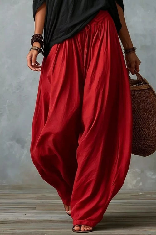 Plus size off-shoulder top and wide-leg pants set by Trendsi, featuring a stylish coordinated outfit in a full size.