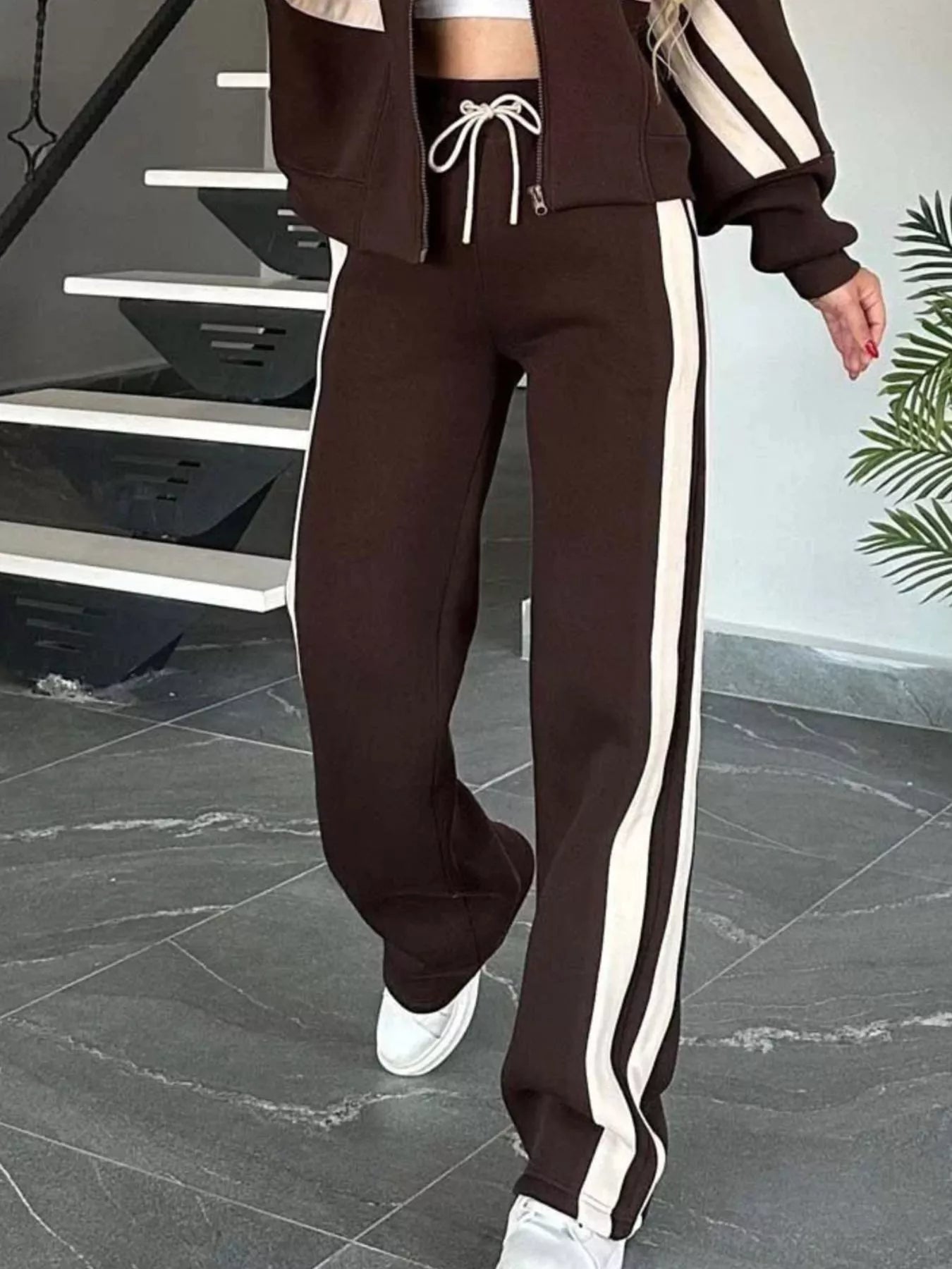 Plus size contrast stripe zip-up activewear jacket and pants set by Plush Fashion Hub, featuring bold stripes and full-length design.